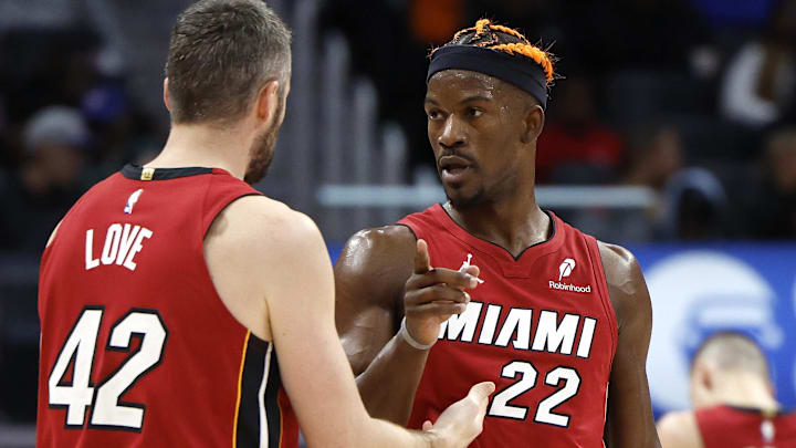 Dec 16, 2024; Detroit, Michigan, USA; Miami Heat forward Kevin Love (42) talks to forward Jimmy Butler (22) in the second half against the Detroit Pistons at Little Caesars Arena. Mandatory Credit: Rick Osentoski-Imagn Images Dec 16, 2024; Detroit, Michigan, USA; Miami Heat forward Kevin Love (42) talks to forward Jimmy Butler (22) in the second half against the Detroit Pistons at Little Caesars Arena. Mandatory Credit: Rick Osentoski-Imagn Images