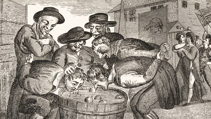 Peasants ducking for apples in a barrel Peasants ducking for apples in a barrel
