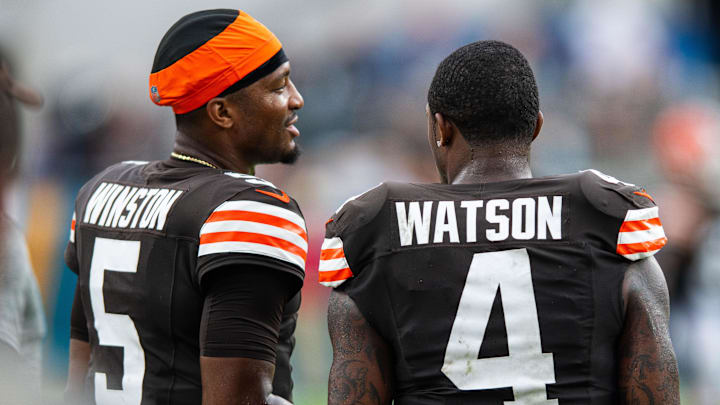 Sep 15, 2024; Jacksonville, Florida, USA; Cleveland Browns quarterback Jameis Winston (5) talks with quarterback Deshaun Watson (4) in the fourth quarter at EverBank Stadium. Mandatory Credit: Jeremy Reper-Imagn Images