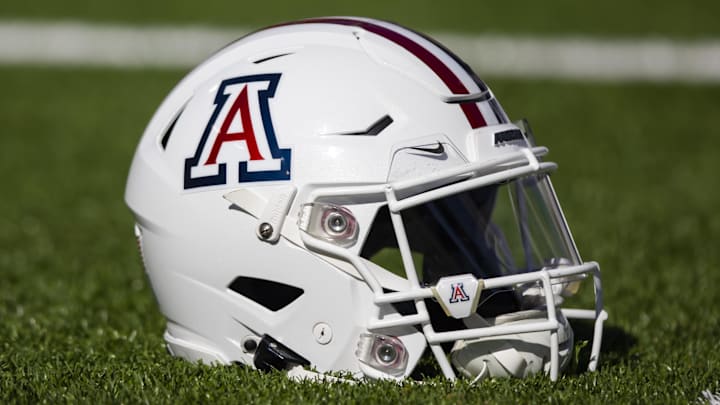 Nov 25, 2022; Tucson, Arizona, USA; Detailed view of an Arizona Wildcats helmet on the field during the Territorial Cup at Arizona Stadium. Mandatory Credit: Mark J. Rebilas-Imagn Images Nov 25, 2022; Tucson, Arizona, USA; Detailed view of an Arizona Wildcats helmet on the field during the Territorial Cup at Arizona Stadium. Mandatory Credit: Mark J. Rebilas-Imagn Images