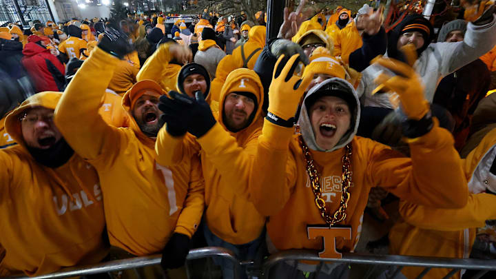 Dec 21, 2024; Columbus, Ohio, USA;  Tennessee Volunteers fans gather to watch the team arrive before the game against the Ohio State Buckeyes at Ohio Stadium. Mandatory Credit: Joseph Maiorana-Imagn Images
