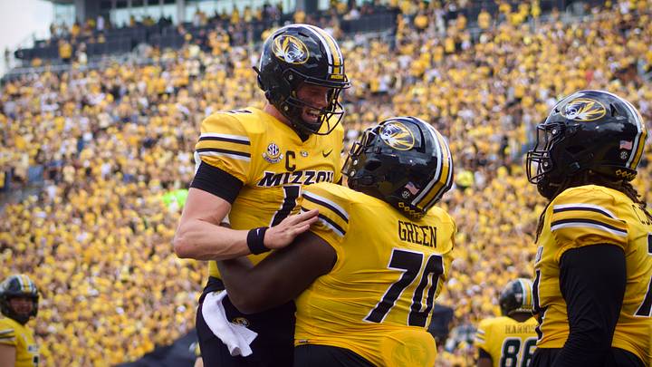 Sep 14, 2024; Columbia, Missouri, USA; Missouri Tigers quarterback Brady Cook (12) celebrates with Tigers offensive lineman Cayden Green (70) following a touchdown against the Boston College Eagles at Faurot Field at Memorial Stadium.