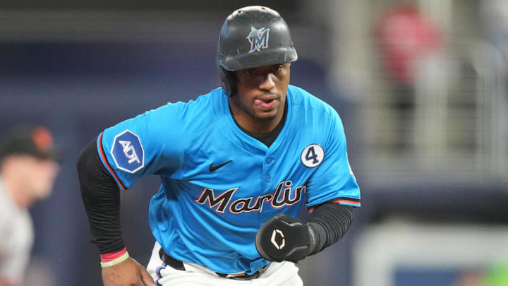 Jun 1, 2025; Miami, Florida, USA;  Miami Marlins second baseman Xavier Edwards (9) advances to third base on a ground out in the first inning against the San Francisco Giants at loanDepot Park. Mandatory Credit: Jim Rassol-Imagn Images