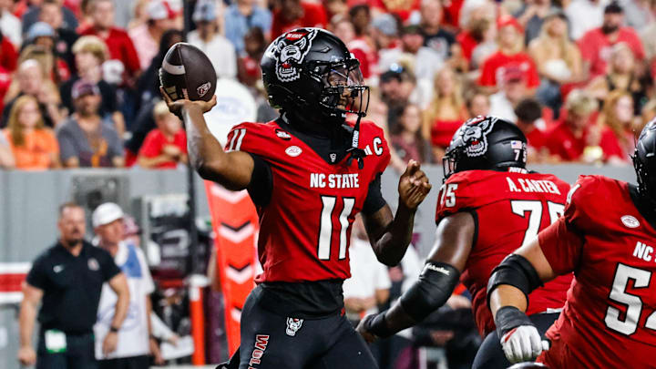 Sep 27, 2025; Raleigh, North Carolina, USA; North Carolina State Wolfpack quarterback CJ Bailey (11) with the ball during the first half of the game against Virginia Tech Hokies at Carter-Finley Stadium. Mandatory Credit: Jaylynn Nash-Imagn Images Sep 27, 2025; Raleigh, North Carolina, USA; North Carolina State Wolfpack quarterback CJ Bailey (11) with the ball during the first half of the game against Virginia Tech Hokies at Carter-Finley Stadium. Mandatory Credit: Jaylynn Nash-Imagn Images