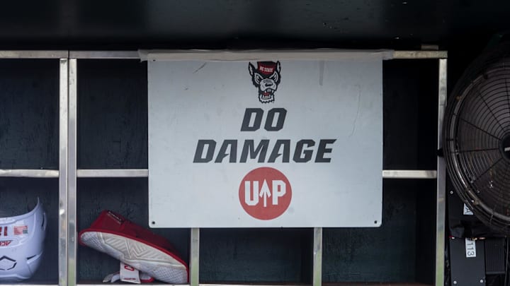 Jun 17, 2024; Omaha, NE, USA; NC State Wolfpack shortstop Brandon Butterworth (3) walks through the dugout before the game against the Florida Gators at Charles Schwab Field Omaha. Mandatory Credit: Dylan Widger-Imagn Images