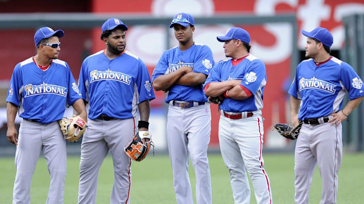 From left National League players from Rafael Furcal, Pablo Sandoval, Starlin Castro, Carlos Ruiz and Jose Altuve stand in the infield during batting practice before the 2012 All-Star Game at Kauffman Stadium in Kansas City, Missouri on July 10, 2012.