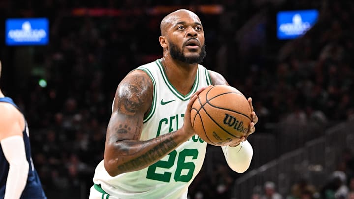 Nov 24, 2024; Boston, Massachusetts, USA; Boston Celtics forward Xavier Tillman (26) shoots a free throw against the Minnesota Timberwolves during the first half at TD Garden. Mandatory Credit: Eric Canha-Imagn Images