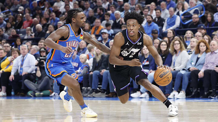 Jan 22, 2025; Oklahoma City, Oklahoma, USA; Utah Jazz guard Collin Sexton (2) drives to the basket around Oklahoma City Thunder guard Cason Wallace (22) during the second half at Paycom Center. Mandatory Credit: Alonzo Adams-Imagn Images Jan 22, 2025; Oklahoma City, Oklahoma, USA; Utah Jazz guard Collin Sexton (2) drives to the basket around Oklahoma City Thunder guard Cason Wallace (22) during the second half at Paycom Center. Mandatory Credit: Alonzo Adams-Imagn Images