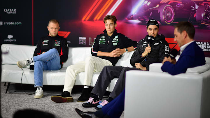Nov 20, 2024; Las Vegas, Nevada, USA; Haas F1 driver Kevin Magnussen (20) Mercedes AMG Petronas driver George Russell (63) and BWT Alpine driver Esteban Ocon (31) during media availabilities at Las Vegas Circuit. Mandatory Credit: Gary A. Vasquez-Imagn Images