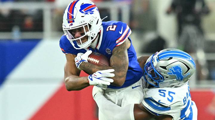Detroit Lions LB Derrick Barnes tackles Buffalo Bills WR DJ Moore during the first half at New Highmark Stadium. Detroit Lions LB Derrick Barnes tackles Buffalo Bills WR DJ Moore during the first half at New Highmark Stadium.