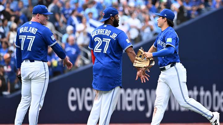 Sep 12, 2026; Toronto, Ontario, CAN; Toronto Blue Jays center fielder Brett Bateman (21) celebrates with first baseman Vladimir Guerrero Jr. (27) and relief pitcher Louis Varland (77) after a win over the Baltimore Orioles at Rogers Centre. Mandatory Credit: Dan Hamilton-Imagn Images Sep 12, 2026; Toronto, Ontario, CAN; Toronto Blue Jays center fielder Brett Bateman (21) celebrates with first baseman Vladimir Guerrero Jr. (27) and relief pitcher Louis Varland (77) after a win over the Baltimore Orioles at Rogers Centre. Mandatory Credit: Dan Hamilton-Imagn Images