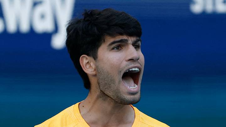 Carlos Alcaraz reacts after winning a game Carlos Alcaraz reacts after winning a game