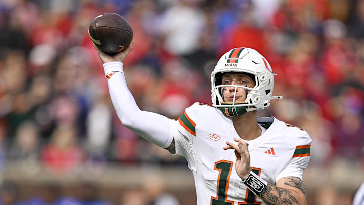 Nov 1, 2025; Dallas, Texas, USA;  Miami Hurricanes quarterback Carson Beck (11) throws the ball against the SMU Mustangs during the second quarter at Gerald J. Ford Stadium. Mandatory Credit: Jerome Miron-Imagn Images
