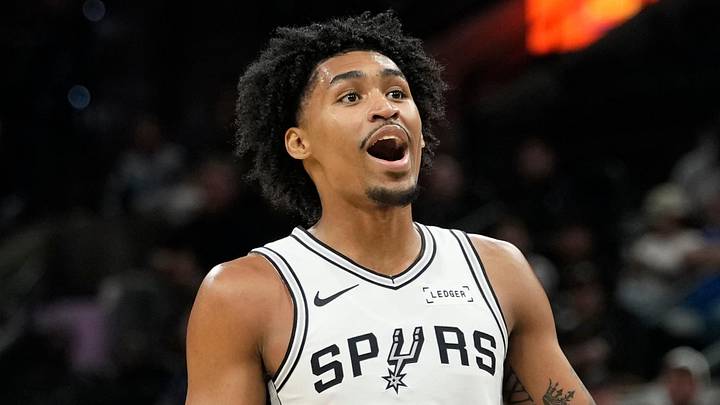 Oct 10, 2025; San Antonio, Texas, USA; San Antonio Spurs guard Dylan Harper (2) reacts after making an alley-oop pass to forward Victor Wembanyama (1) during the first half against the Utah Jazz at Frost Bank Center. Mandatory Credit: Scott Wachter-Imagn Images