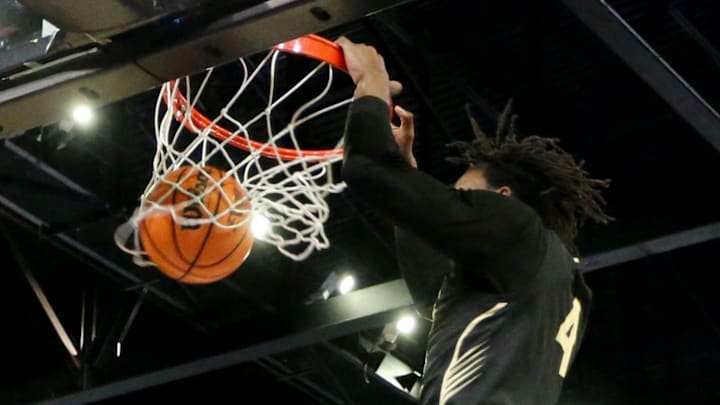 Hale County forward Gage Mayfield (4) dunks the ball against Fultondale at Bill Harris Arena after the Central Region semifinal game Monday.