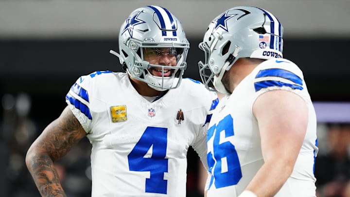 Dallas Cowboys quarterback Dak Prescott and center Cooper Beebe warm up before a game against the Las Vegas Raiders Dallas Cowboys quarterback Dak Prescott and center Cooper Beebe warm up before a game against the Las Vegas Raiders