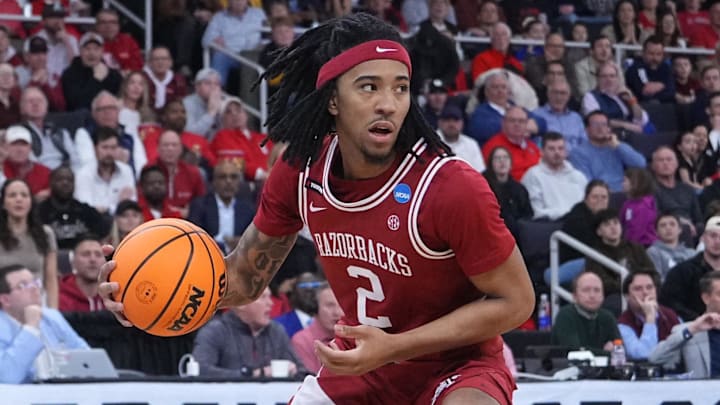 Mar 22, 2025; Providence, RI, USA; Arkansas Razorbacks guard Boogie Fland (2) dribbles against St. John's Red Storm guard Aaron Scott (0) during the second half of a second round men’s NCAA Tournament game at Amica Mutual Pavilion. Mandatory Credit: Gregory Fisher-Imagn Images Mar 22, 2025; Providence, RI, USA; Arkansas Razorbacks guard Boogie Fland (2) dribbles against St. John's Red Storm guard Aaron Scott (0) during the second half of a second round men’s NCAA Tournament game at Amica Mutual Pavilion. Mandatory Credit: Gregory Fisher-Imagn Images