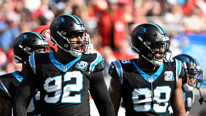 Nov 24, 2024; Charlotte, North Carolina, USA; Carolina Panthers defensive end Jonathan Harris (92) and linebacker D.J. Wonnum (98) on the field in the first quarter at Bank of America Stadium. Mandatory Credit: Bob Donnan-Imagn Images