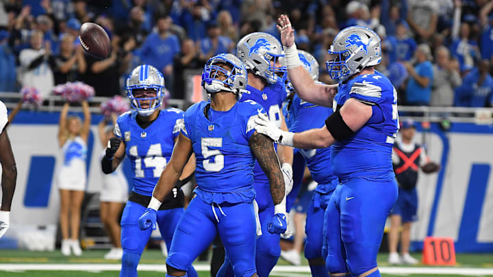 Detroit Lions running back David Montgomery (5) celebrates in the end zone after scoring his second touchdown of the game