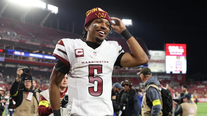 Washington Commanders quarterback Jayden Daniels celebrates after a win.