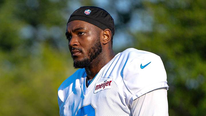 Detroit Lions defensive line coach Kacy Rodgers, left, talks to wide receiver Greg Dortch (8) during training camp at Meijer Performance Center in Allen Park on Friday, July 31, 2026.