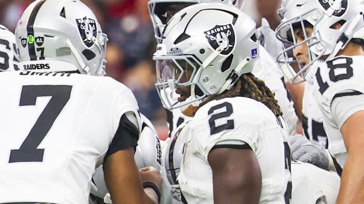 Dec 21, 2025; Houston, Texas, USA; Las Vegas Raiders quarterback Geno Smith (7) stands in the huddle with offensive tackle Stone Forsythe (70), running back Ashton Jeanty (2), wide receiver Jack Bech (18) and tight end Brock Bowers (89) during the second quarter against the Houston Texans at NRG Stadium. Mandatory Credit: Thomas Shea-Imagn Images