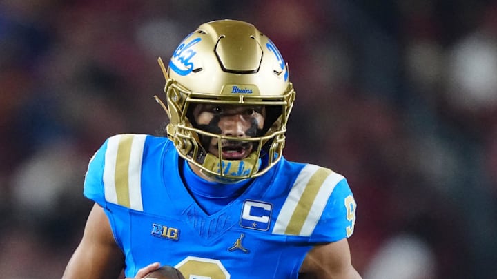 Nov 29, 2025; Los Angeles, California, USA; UCLA Bruins quarterback Nico Iamaleava (9) carries the ball against the Southern California Trojans in the first half at United Airlines Field at Los Angeles Memorial Coliseum. Mandatory Credit: Kirby Lee-Imagn Images