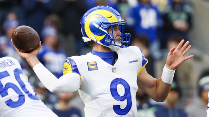 Nov 3, 2024; Seattle, Washington, USA; Los Angeles Rams quarterback Matthew Stafford (9) passes against the Seattle Seahawks during the first quarter at Lumen Field. Mandatory Credit: Joe Nicholson-Imagn Images