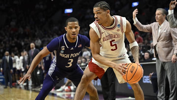 Mar 21, 2026; Portland, OR, USA; Arkansas Razorbacks guard Darius Acuff Jr. (5) drives against High Point Panthers guard Rob Martin (3) in the second half during a second-round game of the men's 2026 NCAA Tournament at Moda Center. Mandatory Credit: Troy Wayrynen-Imagn Images