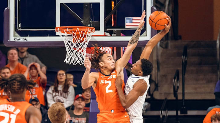 Illinois guard Dra Gibbs-Lawhorn (2) rises up to challenge the shot of a Washington player in the Illini's 77-75 win over the Huskies on Sunday at Alaska Airlines Arena in Seattle.