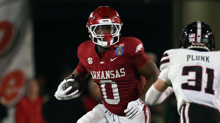 Dec 27, 2024; Memphis, TN, USA; Arkansas Razorbacks running back Braylen Russell (0) runs the ball during the third quarter against the Texas Tech Red Raiders at Simmons Bank Liberty Stadium. Mandatory Credit: Petre Thomas-Imagn Images