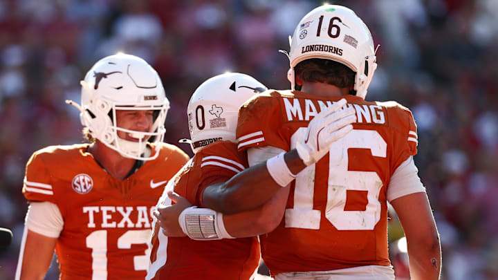 Texas Longhorns wide receiver DeAndre Moore Jr. celebrates with Texas Longhorns quarterback Arch Manning