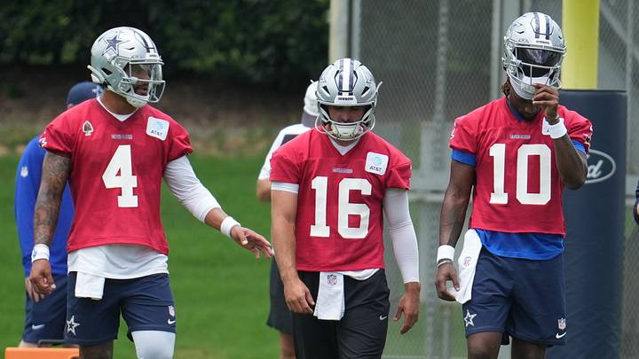 Dallas Cowboys quarterbacks Dak Prescott, Sam Howell, and Joe Milton III walk onto the field during practice Dallas Cowboys quarterbacks Dak Prescott, Sam Howell, and Joe Milton III walk onto the field during practice