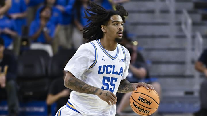Nov 4, 2024; Los Angeles, California, USA; UCLA Bruins guard Skyy Clark (55) brigs the ball up court during the second half against the Rider Broncs at Pauley Pavilion presented by Wescom. Mandatory Credit: Robert Hanashiro-Imagn Images