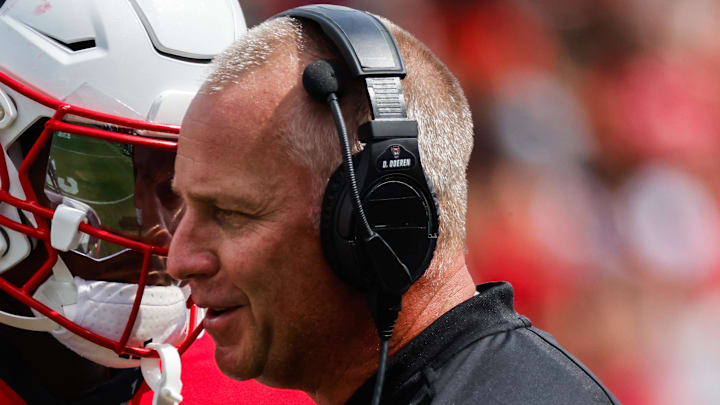 Sep 14, 2024; Raleigh, North Carolina, USA; North Carolina State Wolfpack tight end Justin Joly (15) and head coach Dave Doeren talk during the second half of the game against Louisiana Tech Bulldogs at Carter-Finley Stadium. Mandatory Credit: Jaylynn Nash-Imagn Images Sep 14, 2024; Raleigh, North Carolina, USA; North Carolina State Wolfpack tight end Justin Joly (15) and head coach Dave Doeren talk during the second half of the game against Louisiana Tech Bulldogs at Carter-Finley Stadium. Mandatory Credit: Jaylynn Nash-Imagn Images