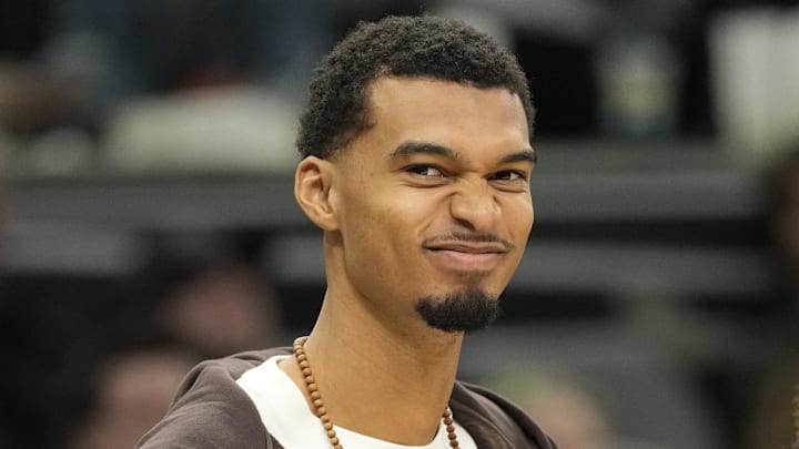 Dec 2, 2025; San Antonio, Texas, USA; San Antonio Spurs forward Victor Wembanyama (1) along with forward Carter Bryant (11) react from the bench during the second half against the Memphis Grizzlies at Frost Bank Center. Mandatory Credit: Scott Wachter-Imagn Images
