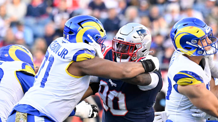 Nov 17, 2024; Foxborough, Massachusetts, USA;  New England Patriots defensive tackle Christian Barmore (90) blocks Los Angeles Rams offensive tackle Warren McClendon Jr. (71) during the first half at Gillette Stadium. Mandatory Credit: Eric Canha-Imagn Images