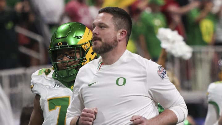 Jan 9, 2026; Atlanta, GA, USA; Oregon Ducks head coach Dan Lanning leads his team onto the field prior to the 2025 Peach Bowl and semifinal game of the College Football Playoff against the Indiana Hoosiers at Mercedes-Benz Stadium. Mandatory Credit: Brett Davis-Imagn Images Jan 9, 2026; Atlanta, GA, USA; Oregon Ducks head coach Dan Lanning leads his team onto the field prior to the 2025 Peach Bowl and semifinal game of the College Football Playoff against the Indiana Hoosiers at Mercedes-Benz Stadium. Mandatory Credit: Brett Davis-Imagn Images