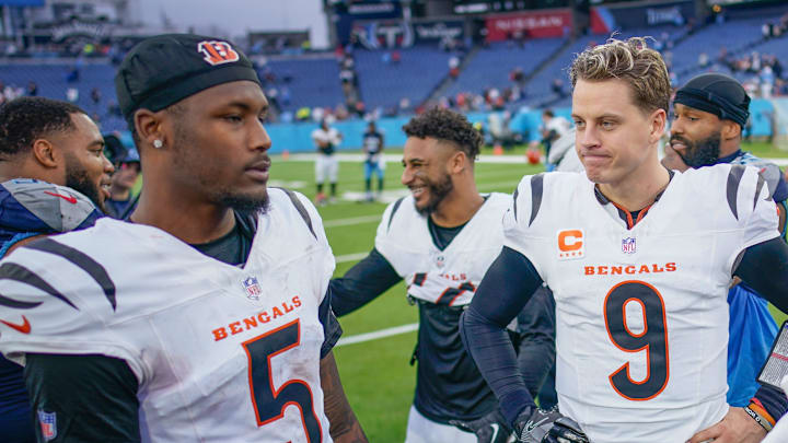 Cincinnati Bengals quarterback Joe Burrow (9) chats with wide receiver Tee Higgins (5) and Tennessee Titans wide receiver Tyler Boyd (83) after the game at Nissan Stadium in Nashville, Tenn., Sunday, Dec. 15, 2024.
