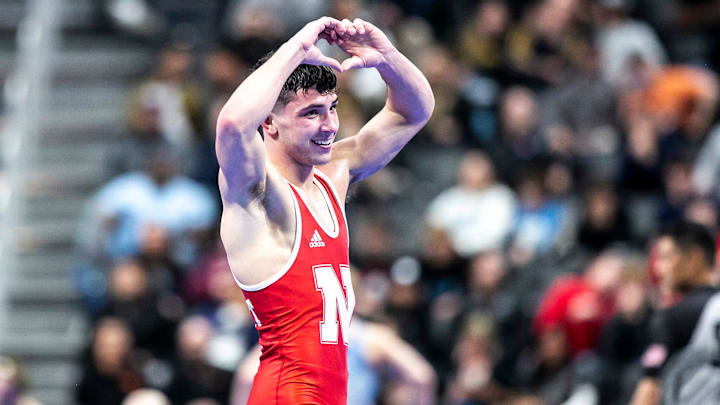 Nebraska's Ridge Lovett celebrates after scoring a decision in the 2022 national semifinals. Nebraska's Ridge Lovett celebrates after scoring a decision in the 2022 national semifinals.