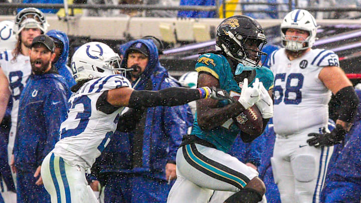Jacksonville Jaguars wide receiver Brian Thomas Jr. (7) hauls in a pass as Indianapolis Colts cornerback Kenny Moore II (23) pressures him in the third quarter during an NFL football game at EverBank Stadium, Sunday, Dec. 7, 2025, in Jacksonville, Fla. Jaguars won 36-19. [Doug Engle/Florida Times-Union]