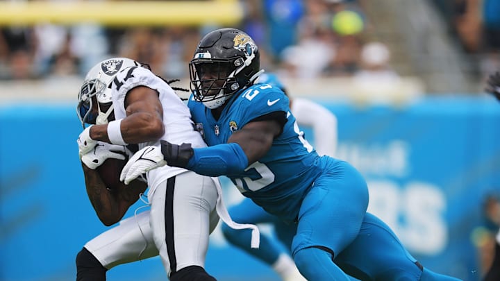 Jacksonville Jaguars linebacker Foyesade Oluokun (23) tackles Las Vegas Raiders wide receiver Davante Adams (17) during the first quarter of a regular season NFL football matchup Sunday, Nov. 6, 2022 at TIAA Bank Field in Jacksonville. The Jacksonville Jaguars held off the Las Vegas Raiders 27-20. [Corey Perrine/Florida Times-Union]

Jki 110622 Raiders Jags Cp 50