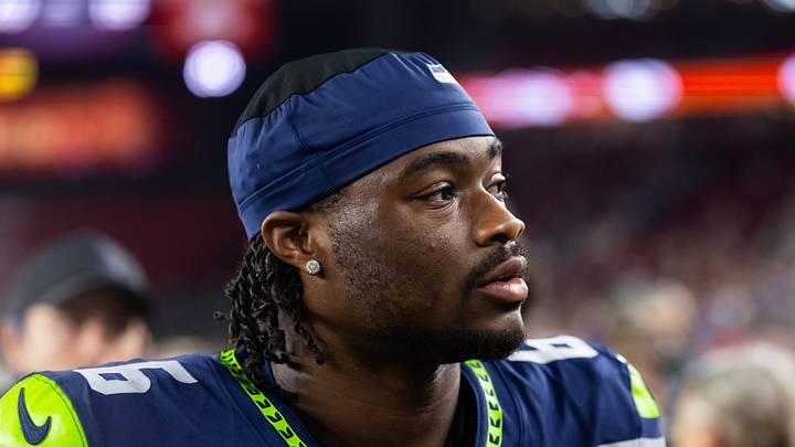 Seattle Seahawks quarterback Jalen Milroe stands on the field