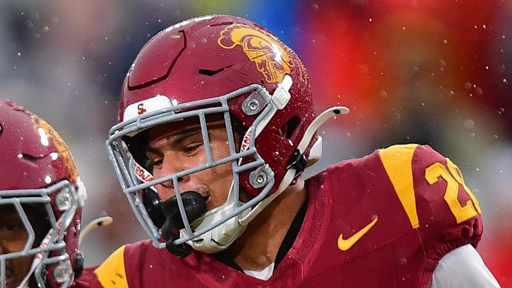 Nov 15, 2025; Los Angeles, California, USA; Southern California Trojans cornerback Alex Graham (27) safety Christian Pierce (24) cornerback Decarlos Nicholson (17) and safety Kennedy Urlacher (28) celebrate after Iowa Hawkeyes turn the ball over on fourth down during the second half at the Los Angeles Memorial Coliseum. Mandatory Credit: Gary A. Vasquez-Imagn Images Nov 15, 2025; Los Angeles, California, USA; Southern California Trojans cornerback Alex Graham (27) safety Christian Pierce (24) cornerback Decarlos Nicholson (17) and safety Kennedy Urlacher (28) celebrate after Iowa Hawkeyes turn the ball over on fourth down during the second half at the Los Angeles Memorial Coliseum. Mandatory Credit: Gary A. Vasquez-Imagn Images