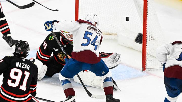 Mar 20, 2026; Chicago, Illinois, USA;  Colorado Avalanche center Gavin Brindley (54) shoots against Chicago Blackhawks goaltender Arvid Soderblom (40) during the third period at United Center. Mandatory Credit: Matt Marton-Imagn Images