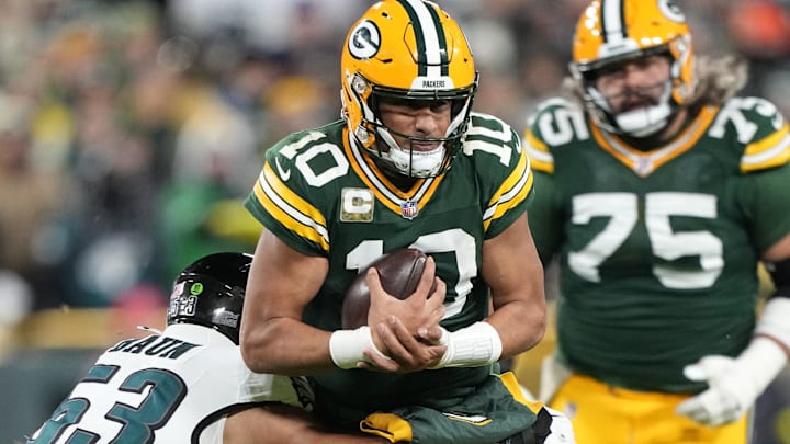 Green Bay Packers quarterback Jordan Love (10) is tackled by. Philadelphia Eagles linebacker Zack Baun. Green Bay Packers quarterback Jordan Love (10) is tackled by. Philadelphia Eagles linebacker Zack Baun.