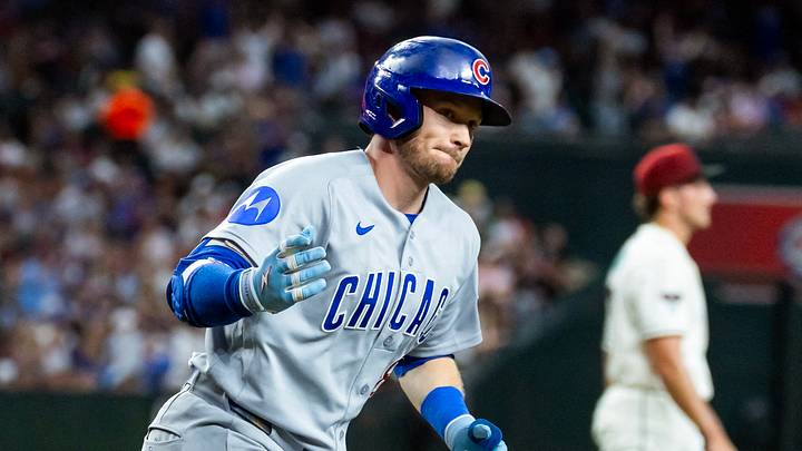 Aug 25, 2026; Phoenix, Arizona, USA; Chicago Cubs outfielder Ian Happ tosses his bat after hitting a three run home run in the fourth inning against Arizona Diamondbacks pitcher Brandon Pfaadt at Chase Field. Mandatory Credit: Mark J. Rebilas-Imagn Images