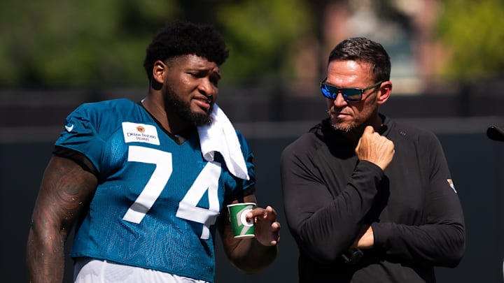 Jacksonville Jaguars offensive tackle Fred Johnson (74) talks with Executive Vice President, Football Operations, of the Jacksonville Jaguars Tony Boselli, during an NFL training camp fourth session at the Miller Electric Center, Sunday, July 27, 2025, in Jacksonville, Fla. [Doug Engle/Florida Times-Union]