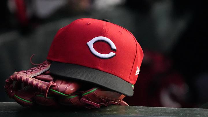 May 5, 2026; Chicago, Illinois, USA; A detail shot of Cincinnati Reds hat and glove in the dugout during the fourth inning against the Chicago Cubs at Wrigley Field. Mandatory Credit: David Banks-Imagn Images May 5, 2026; Chicago, Illinois, USA; A detail shot of Cincinnati Reds hat and glove in the dugout during the fourth inning against the Chicago Cubs at Wrigley Field. Mandatory Credit: David Banks-Imagn Images
