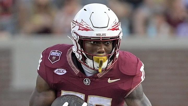 Sep 20, 2025; Tallahassee, Florida, USA; Florida State Seminoles running back Samuel Singleton Jr. (28) runs the ball during the second half against the Kent State Golden Flashes at Doak S. Campbell Stadium. Mandatory Credit: Melina Myers-Imagn Images